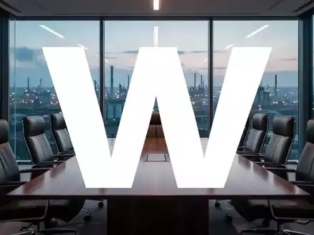 Leerer Konferenztisch in einem modernen Bürogebäude mit Blick auf eine Industrielandschaft bei Dämmerung. - Foto: über boerse-global.de