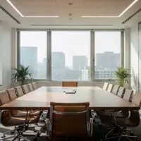 Ein leerer, modern eingerichteter Konferenzraum mit einem Holztisch und Stühlen in einer hellen, professionellen Büroumgebung. - Foto: über boerse-global.de