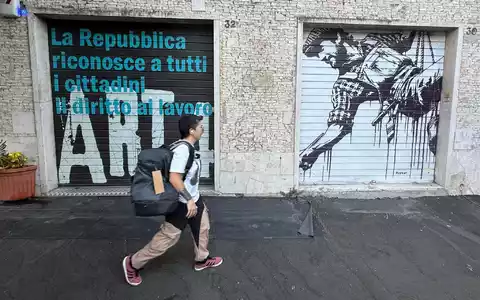 Anders als in den deutschen Innenstädten mit ihren vielen Schaufenstern hat in Italien noch so gut wie jedes Geschäft die schweren metallenen Rollläden. - Foto: Christoph Sator/dpa