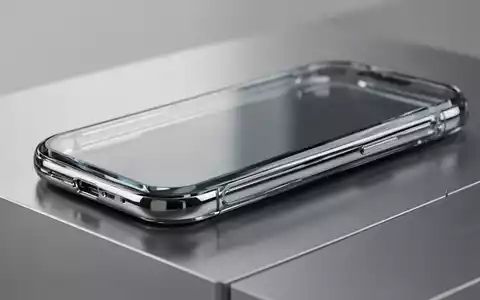 Ein hochwertiges Smartphone-Modell mit Glasgehäuse und Metallrahmen auf einer minimalistischen Oberfläche. - Foto: über boerse-global.de