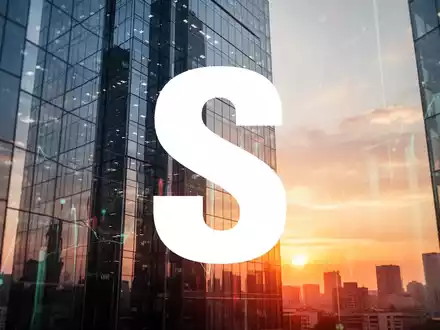 Abstrakte Darstellung eines modernen Bürogebäudes im Sonnenaufgang als Symbol für positive Marktstimmung und Wachstum. - Foto: über boerse-global.de