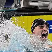 Johannes Liebmann schreit seine Freude heraus. Sonst ist er eher ruhig. - Foto: Julien De Rosa/AFP/dpa