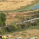Auf Luftbildern ist zu sehen, wie Teile des Zuges auf der Seite liegen. - Bild: Pa/PA Wire/dpa