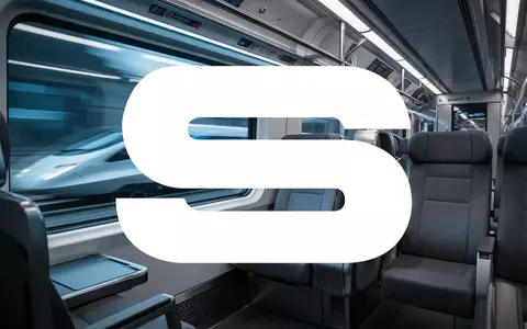Ein moderner Zuginnenraum mit verschwommener Außenansicht, der technologischen Fortschritt und industrielle Innovation symbolisiert. - Foto: über boerse-global.de