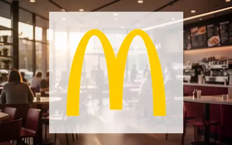 Abstrakte Darstellung eines modernen Gastronomiebereichs in warmem Licht, das ein stabiles Marktwachstum symbolisiert. - Foto: über boerse-global.de