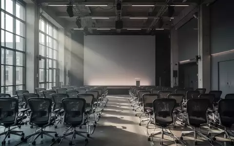 Moderner, minimalistischer Konferenzraum in Berlin mit natürlichem Licht, bereit für eine politische Veranstaltung. - Foto: über boerse-global.de