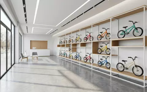 Architektur-Render im Fahrradgeschaeft mit Kinderfahrrad zum Thema woom 3 Kinderfahrrad 16, neutrales Tageslicht - Foto: THN