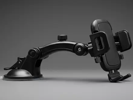 Fotorealistische Studioaufnahme von Handyhalter zum Thema Nulaxy Handyhalter Auto Windschutzscheibe, klare Lichtfuehrung - Foto: THN