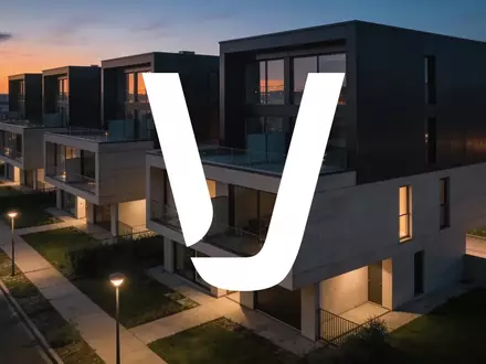 Moderne Wohnarchitektur bei Dämmerung, die die Stimmung des Immobilienmarktes widerspiegelt. - Foto: über boerse-global.de