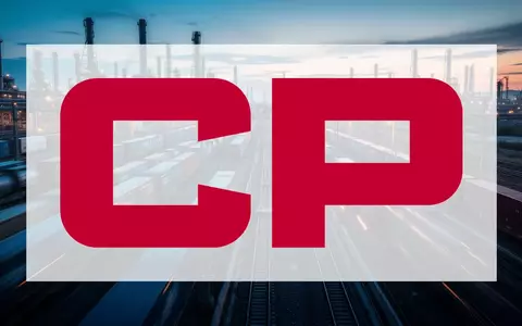Ein moderner Güterbahnhof in der Abenddämmerung mit verschwommenen Zügen, die industrielle Logistik und Arbeitskonflikte symbolisieren. - Foto: über boerse-global.de