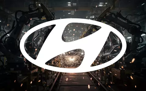 Abstrakte Darstellung industrieller Arbeitskämpfe in einer Automobilfabrik mit Fokus auf mechanische Stille und Spannung. - Foto: über boerse-global.de