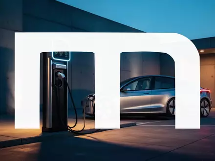 Moderne Ladestation für Elektrofahrzeuge in einer minimalistischen Industrieumgebung bei Dämmerung. - Foto: über boerse-global.de