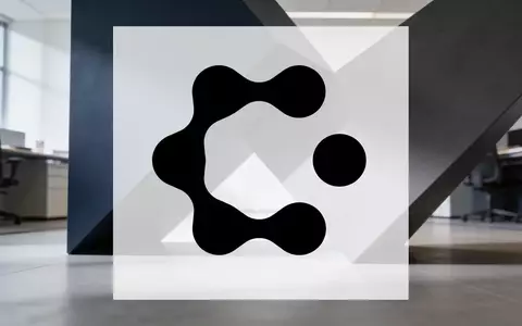 Abstrakte Darstellung einer Unternehmensfusion durch ineinandergreifende geometrische Formen in einem modernen Büro. - Foto: über boerse-global.de