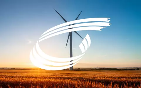 Moderne Windkraftanlage in einer sonnigen Landschaft als Symbol für Investitionen in erneuerbare Energien. - Foto: über boerse-global.de