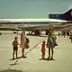 Damals war man noch wer als Deutscher: Touristen aus dem Ruhrgebiet kommen 1973 - noch zur Zeit von Diktator Franco - auf dem Flughafen von Ibiza an. (Archivbild) - Bild: Christoph  Driessen/dpa