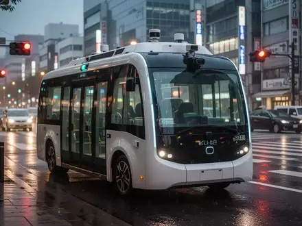 Ein autonomer Bus fährt bei Dämmerung durch eine städtische Kreuzung in Japan, ausgestattet mit moderner Sensorik. - Foto: über boerse-global.de