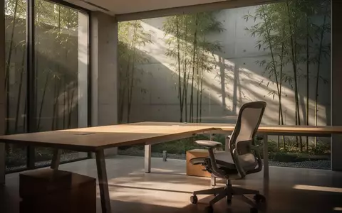 Ein minimalistischer, heller Büroarbeitsplatz mit einem leeren Schreibtisch und einer ruhigen, von Pflanzen geprägten Umgebung. - Foto: über boerse-global.de