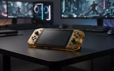 Ein transluzentes goldenes Handheld-Spielgerät auf einer dunklen Oberfläche vor einem unscharfen Gaming-Hintergrund. - Foto: über boerse-global.de