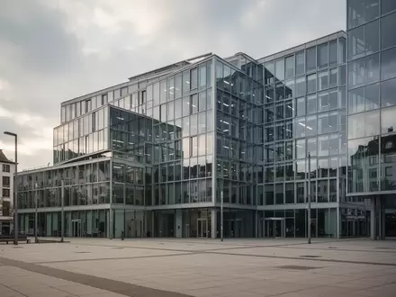 Modernes Bürogebäude an einem bewölkten Sommertag als Symbol für die aktuelle Lage am deutschen Arbeitsmarkt. - Foto: über boerse-global.de
