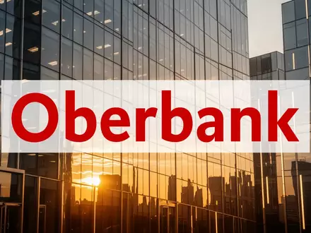Moderne Glasfassade eines Bankgebäudes im goldenen Licht, symbolisiert finanzielles Wachstum und Stabilität. - Foto: über boerse-global.de