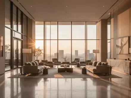 Modernes, minimalistisches Hotelfoyer mit einfallendem Sonnenlicht und hochwertiger Einrichtung. - Foto: über boerse-global.de