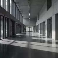 Ein minimalistischer, leerer Flur in einem modernen Regierungsgebäude mit architektonischen Schattenwürfen. - Foto: über boerse-global.de