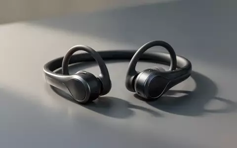 Moderne Open-Ear-Kopfhörer in minimalistischem Design auf einer grauen Oberfläche bei natürlichem Licht. - Foto: über boerse-global.de