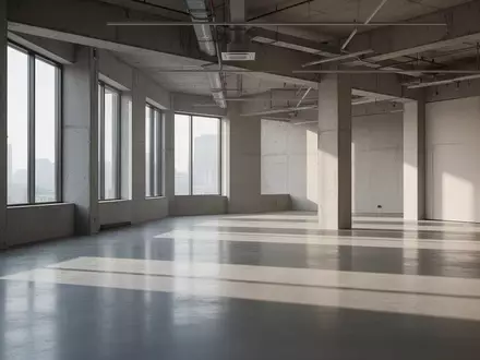 Modernes, leeres Bürogebäude mit minimalistischer Architektur und einfallendem Tageslicht. - Foto: über boerse-global.de