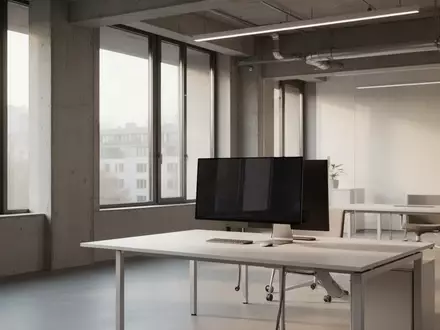Ein moderner, minimalistischer Büroarbeitsplatz mit einem ausgeschalteten Computerbildschirm in einem Verwaltungsgebäude. - Foto: über boerse-global.de