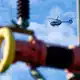Auch ein Polizei-Hubschrauber ist im Einsatz.  - Bild: Henning Kaiser/dpa
