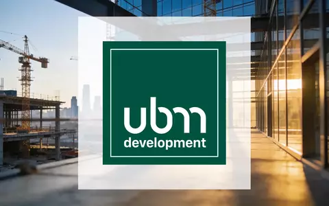 Ein modernes Bürogebäude im Bau während der goldenen Stunde als Symbol für Immobilienentwicklung und wirtschaftliche Wende. - Foto: über boerse-global.de