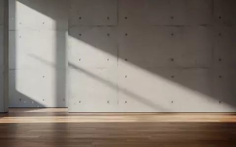 Ein minimalistischer, moderner Innenraum mit klaren Linien und sanftem Lichteinfall, der eine technologische Atmosphäre vermittelt. - Foto: über boerse-global.de