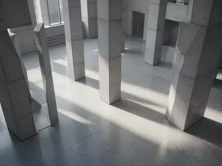 Ein minimalistisch gestaltetes, modernes GebĂ€udeinterieur mit klaren geometrischen Linien und natĂŒrlichem Lichteinfall. - Foto: ĂŒber boerse-global.de