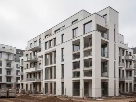Ein moderner Wohnkomplex in städtischer Umgebung bei bedecktem Himmel. - Foto: über boerse-global.de