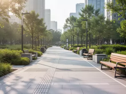 Ein barrierefreier, heller Gehweg in einem öffentlichen Park mit taktilen Leitelementen und Sitzgelegenheiten. - Foto: über boerse-global.de