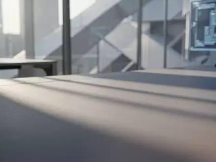 Minimalistischer, aufgeräumter Arbeitsbereich mit weichem Tageslicht und geometrischen Strukturen im Hintergrund. - Foto: über boerse-global.de