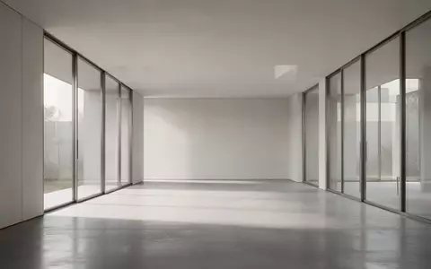 Ein minimalistisches, modernes Interieur mit klaren Linien und hellem, natürlichem Licht auf einem polierten Betonboden. - Foto: über boerse-global.de