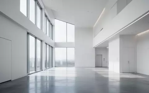 Ein minimalistischer, moderner Innenraum einer klinischen Forschungseinrichtung mit klaren Linien und natürlichem Licht. - Foto: über boerse-global.de
