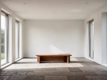 Minimalistisch gestalteter, heller Innenraum mit klaren Linien, Holzelementen und natürlichem Lichteinfall. - Foto: über boerse-global.de