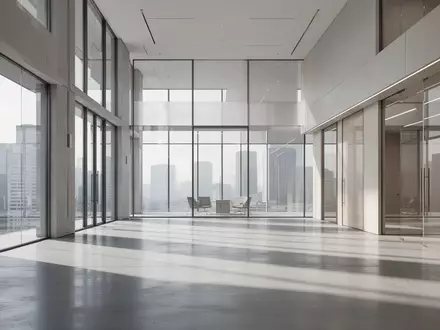 Ein modernes, minimalistisches Bürogebäude mit klaren Linien und natürlichem Licht, das auf einen leeren Boden fällt. - Foto: über boerse-global.de