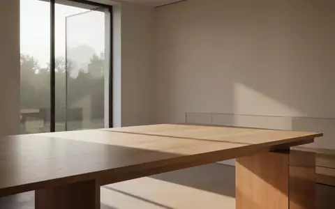 Ein minimalistischer, heller Arbeitsbereich mit natürlichem Lichteinfall und klaren architektonischen Linien. - Foto: über boerse-global.de