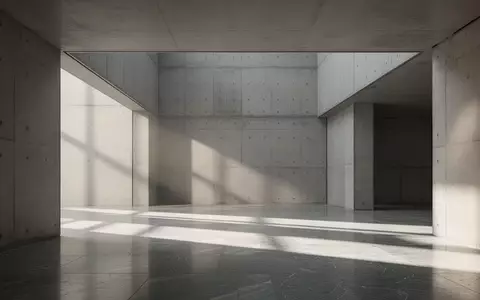 Ein minimalistischer, moderner Innenraum mit klaren architektonischen Linien und sanftem Lichteinfall. - Foto: über boerse-global.de