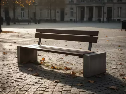 Eine leere Parkbank auf einem sonnigen, ruhigen Stadtplatz ohne Menschen. - Foto: über boerse-global.de