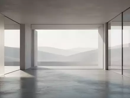 Ein minimalistischer, moderner Innenraum mit klaren geometrischen Linien und natürlichem Licht, das auf einen Betonboden fällt. - Foto: über boerse-global.de