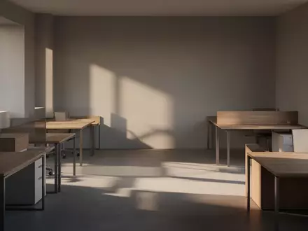 Ein minimalistisch gestalteter, leerer Büroarbeitsplatz mit Holztischen und einfallendem Sonnenlicht in einer ruhigen Atmosphäre. - Foto: über boerse-global.de