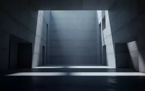 Ein steriler, minimalistischer Architekturraum mit tiefen Schatten und kaltem Licht, der eine bedrohliche Leere vermittelt. - Foto: über boerse-global.de