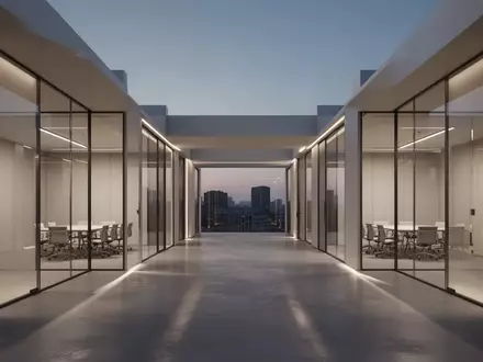 Ein minimalistisches, modernes Bürointerieur mit architektonischen Linien und indirekter Beleuchtung ohne Personen. - Foto: über boerse-global.de