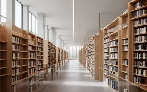 Eine ruhige, moderne Universitätsbibliothek mit hohen Bücherregalen und natürlichem Lichteinfall. - Foto: über boerse-global.de