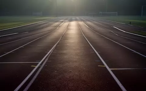 Eine leere, minimalistische Leichtathletikbahn im Licht der Morgendämmerung, die Ruhe und mentale Klarheit symbolisiert. - Foto: über boerse-global.de