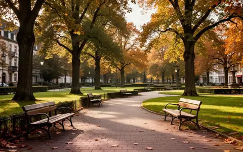 Ein sonniger, leerer öffentlicher Park mit Holzbänken und einem gewundenen Weg in einer deutschen Kleinstadt. - Foto: über boerse-global.de